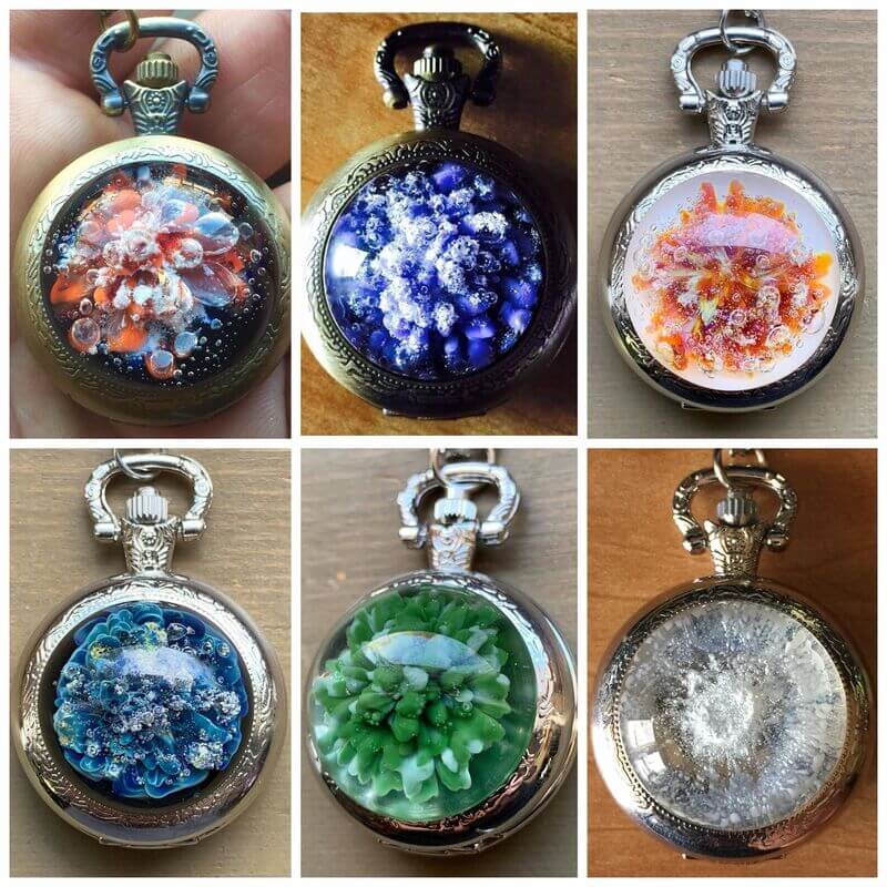 A composite photo of 6 colorful memorial glass pocket watches made using cremation ash