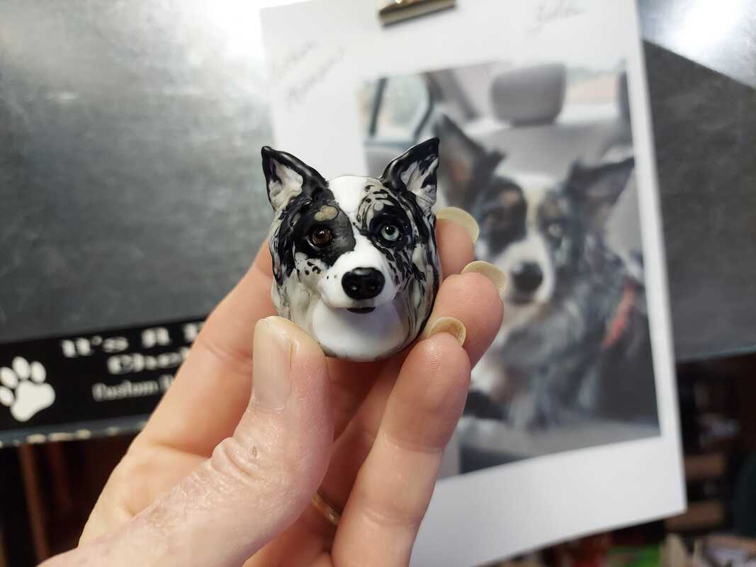 A glass portrait of a dog made using cremation ash